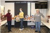 Assistance League volunteers prepare Blizzard Bags.